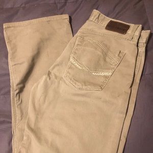 Men’s tan buckle jeans.